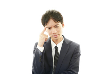 頭痛を訴えるビジネスマン