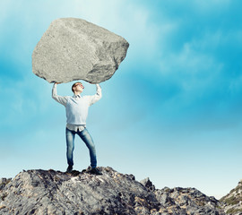 Guy lifting stone