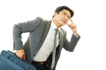 頭痛を訴えるビジネスマン