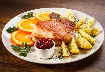 Grilled steak, boiled potatoes and lingonberry jam