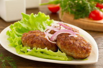 Large fried cutlets with  lettuce
