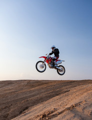 Fototapeta na wymiar rider performs stunts in desert