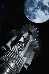 aerospace gears and cogs with full-moon in background