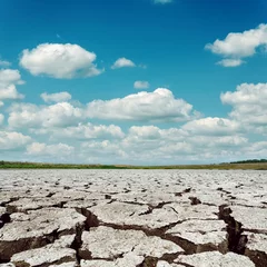 Fotobehang drought earth and dramatic sky with clouds © Mykola Mazuryk