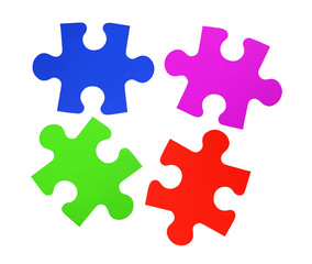 Colorful puzzles closeup isolated on white