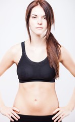 Fototapeta na wymiar Attractive young athletic woman, sports bra