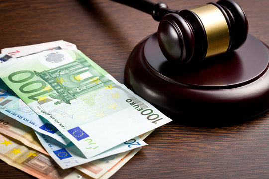 judge gavel with euro bills