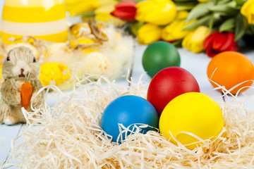 Easter decoration with tulip and colored eggs