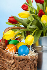 Easter decoration with tulip and colored eggs