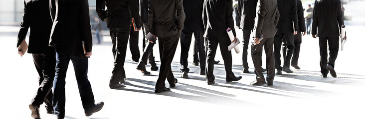 Large group of business people walking.