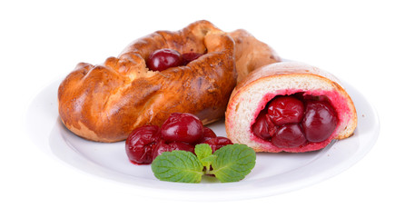 Fresh baked pasties with cherry isolated on white