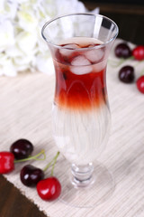 Glass of cocktail on table close-up