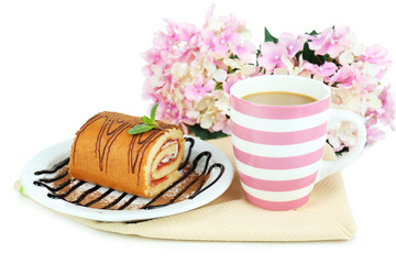 Cup of tea and sweets isolated on white