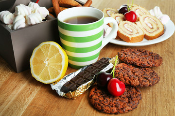Cup of tea and sweets close up