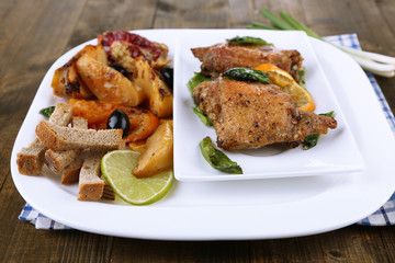 Homemade fried chicken drumsticks with vegetables