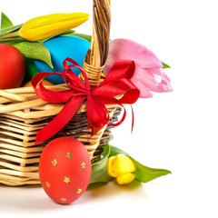 Easter basket with Easter Eggs and tulips