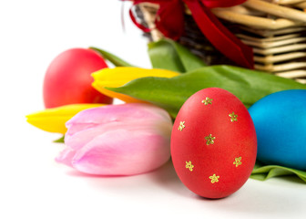Easter basket with Easter Eggs and tulips