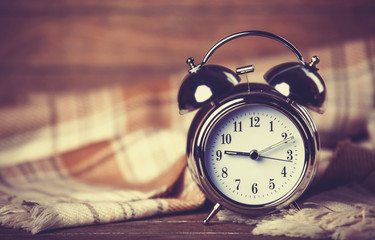 Alarm clock and scarf.