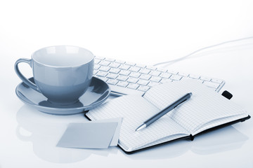 Coffee cup and office supplies
