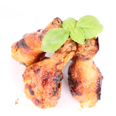 Fried chicken legs decorated with basil