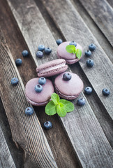 Violet french macarons with blueberry and mint