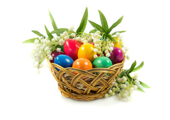 easter eggs in busket on green gras isolated