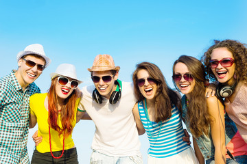 group of young people wearing sunglasses and hat