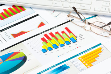 Obraz premium glasses, business papers with charts