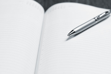 pen and open notepad