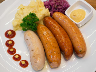Grilled sausages with vegetables and mashed potatoes