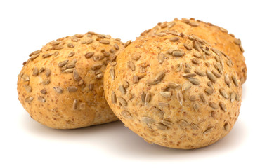 Round sandwich bun with sunflower seeds isolated on white backgr