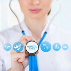Medicine doctor hand holding stethoscope and working with modern
