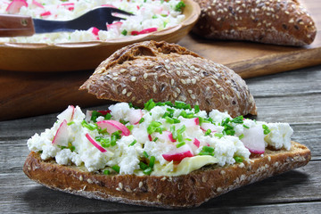 Bread roll with cottage cheese,radish and chives