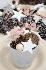 Christmas arrangement with cones and stars