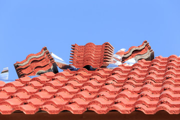 roof under construction with stacks of roof tiles for home build