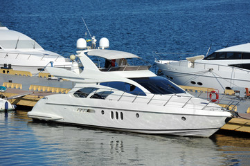 Fototapeta premium White motor yacht over harbor pier, Odessa, Ukraine