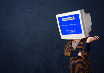Person with a monitor head and fatal error blue screen on the di