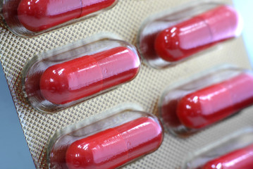 orange capsule in blister pack close up 4