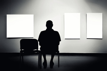 Man sitting in art gallery