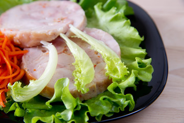 Chicken roulade on salad.