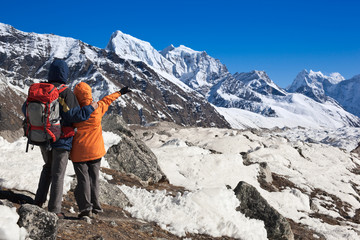 Tourists discuss trekking route in Gokio valley. Nepal