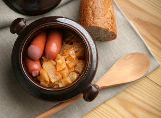 stew cabbage with a sausage