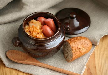 stew cabbage with a sausage