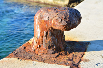 Rusty mooring bollard