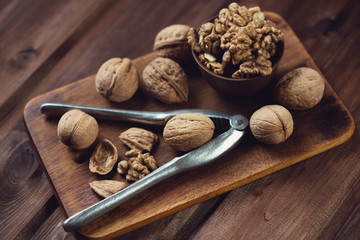 Walnuts on a rustic wooden background, horizontal shot