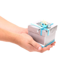Stylish gift box with blue ribbon in hand.