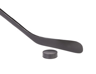 Black ice hockey stick and puck.
