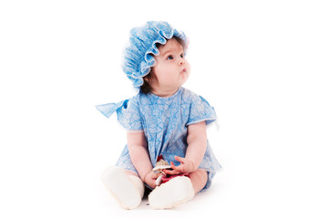 beautiful baby girl in a blue dress