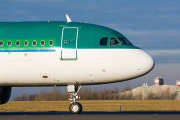 Detail of green plane nose during taxi on taxiway