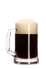 Closeup of mug full with brown beer.